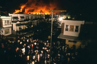 Philadelphia MOVE Bombing Kills 11, Destroys Homes May 13, 1985